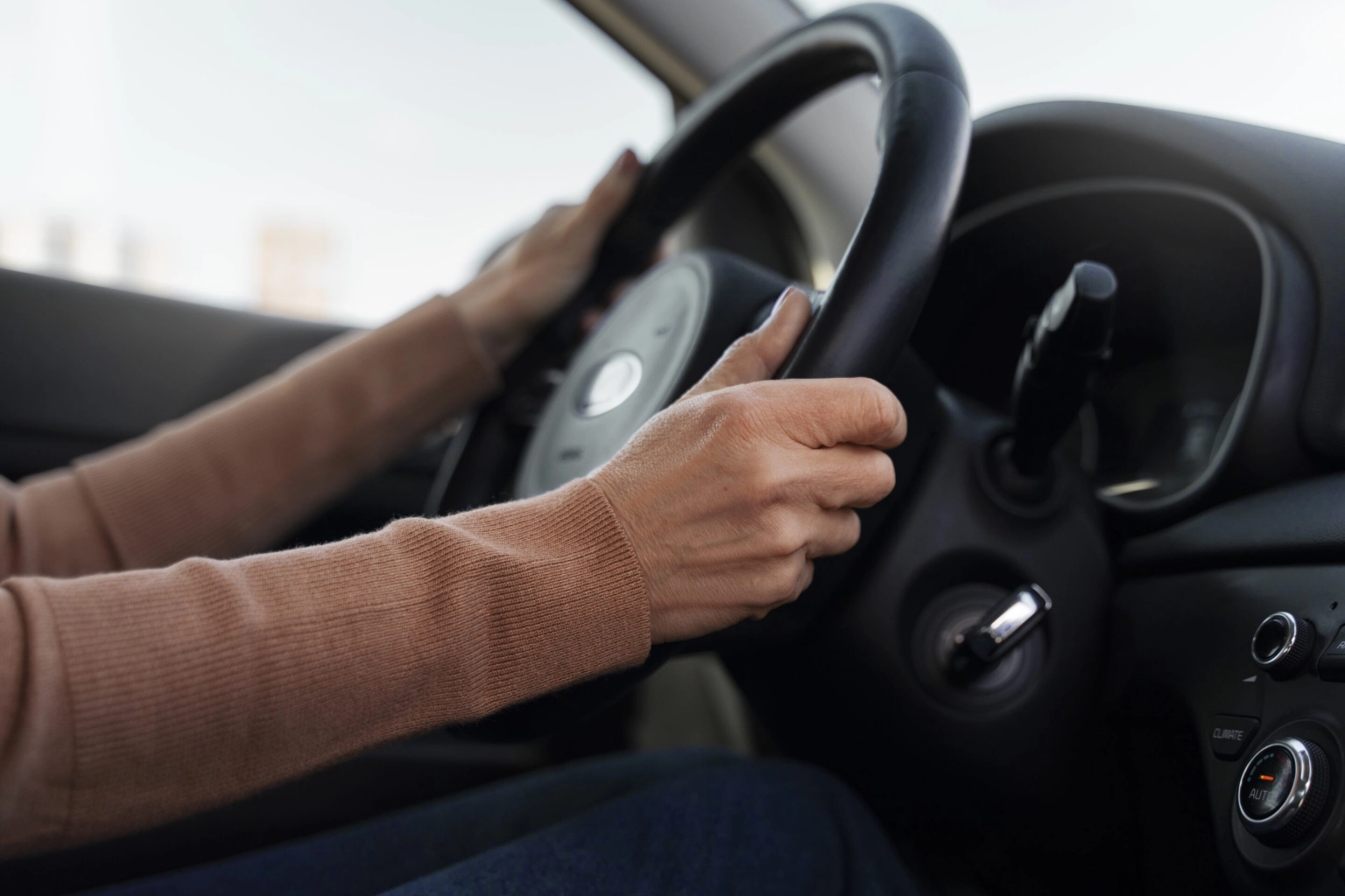 woman-driving-car-test-get-driver-s-license-scaled
